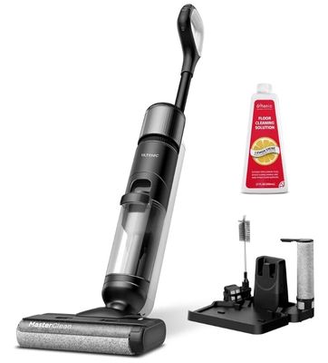 une photo d'un aspirateur sans fil avec une bouteille de produit nettoyant à côté