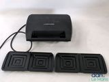 an image of a close up of a toaster and four trays of food