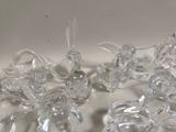 many clear glass figurines sitting on a table