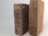 two pieces of wood stacked on top of each other