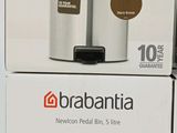 two boxes of brabantia coffee urns sitting on top of each other