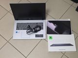 a laptop computer sitting on the floor next to a box