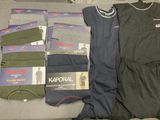 several pairs of men ' s underwear are laid out on a bed