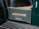a close up of a green truck with a door open