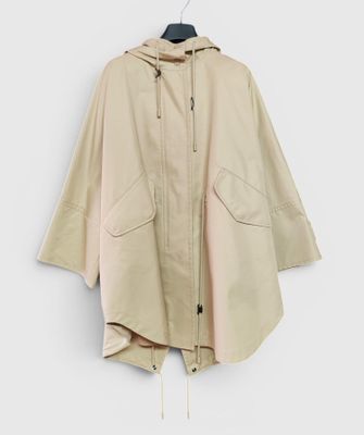 an image of a jacket hanging on a hanger on a wall