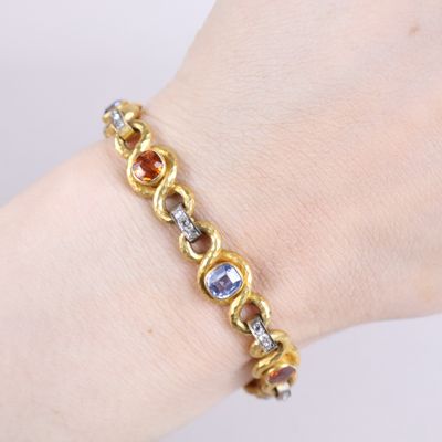 an image of a close up of a person ' s hand wearing a bracelet