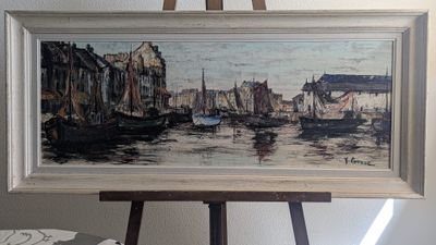 une image d'un tableau sur un chevalet dans une pièce