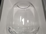 a clear glass bowl in a white box on a table