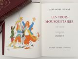 an open book with a picture of a group of people on it