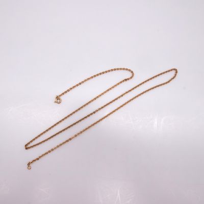 a gold necklace with a chain that has a heart on it