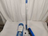 a toothbrush, toothpaste, and tooth brush on a bed