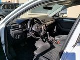 a car that is parked in a lot with its door open
