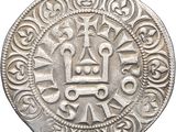 a close up of a coin with a crown on it