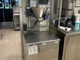 a picture of a machine that is in a kitchen