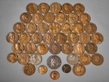 a lot of coins that are on the table