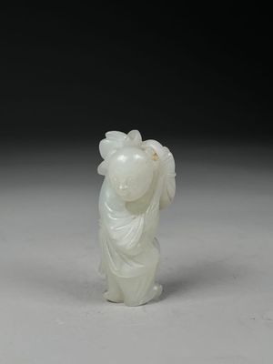 chinese carved jade figurine of a woman with a basket on her head