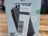 an image of a box of laptop power bank sitting on a wooden table