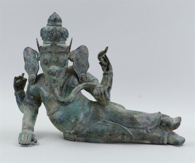 bronze statue of the hindu god sitting on the back of an elephant