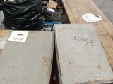 a lot of junk on the floor of a warehouse