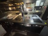 an image of a commercial kitchen with stainless steel counter tops