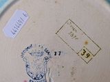 a plate with a stamp on it sitting on a table