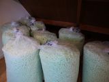 many bags of rice sitting on the floor next to each other