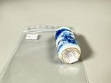 a plastic container with a blue and white design on it