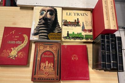 many books that are on a table together