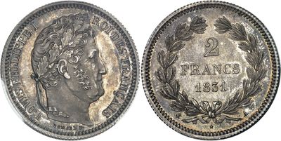 a silver coin with the head of a woman in a wreathed wreath
