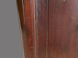 an old wooden cabinet with a metal latch on the door