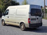 a white van that is parked on the side of the road