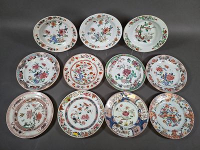 eight chinese plates with flowers and birds on them on a table