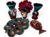 a lot of vases that are sitting on a table