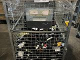 a metal cart with many items in it in a warehouse