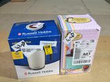 two boxes of coffee on the table next to each other