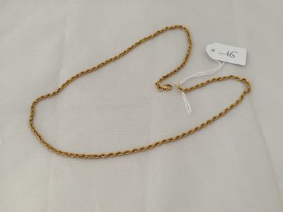 a close up of a gold chain with a tag on it