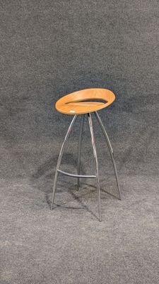 a stool with a wooden seat on a gray background
