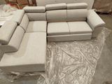 a picture of a couch and ottoman in a warehouse