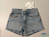a pair of denim shorts that are on a table