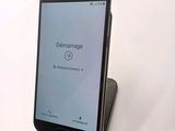 a cell phone that is sitting on top of a stand