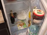 an open refrigerator with a lot of food inside of it