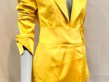 yellow satin blazer and skirt suit with matching belt