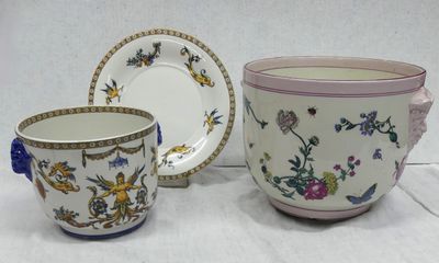 two cups and a saucer sitting on a table