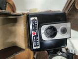 a camera that is sitting on top of a suitcase