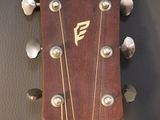 the headstock of a guitar with the name of a person on it