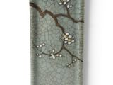 a small rectangular plate with a flower design on it