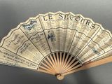 an old fan with a lot of old tickets on it