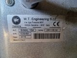 a label on the back of a machine that says w t engineering stl
