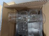 a box with a couple of empty glasses inside of it