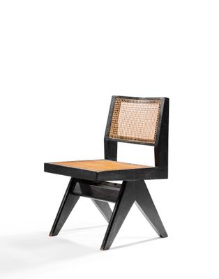 a black chair with a wicker seat and a wooden seat